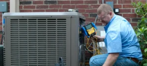 hvac tech performing maintenance